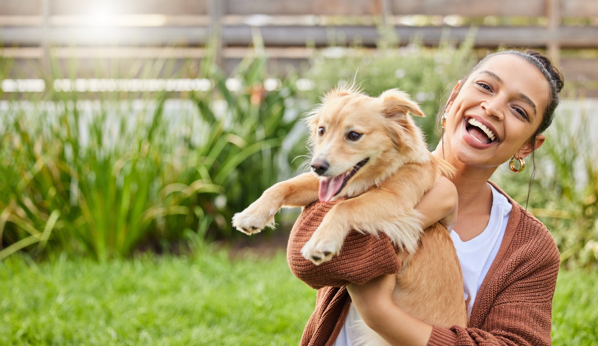 Volunteer holding a rescued dog